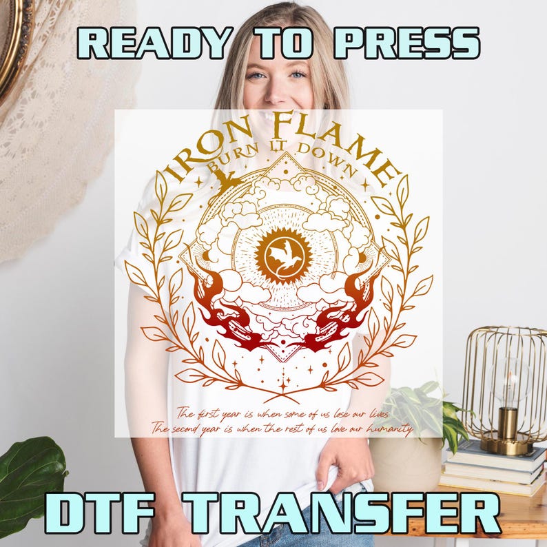 May include: A white DTF transfer sheet featuring a gold and orange graphic with the text "IRON FLAME BURN IT DOWN" and "The first year is when some of us lose our lives. The second year is when the rest of us love our humanity." The design includes a dragon, sun, and leaves.