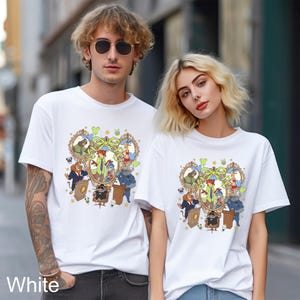 May include: White t-shirts featuring a colorful cartoon design with various animal characters in a frame. The shirts are short-sleeved and worn by two people. The word "White" is printed at the bottom left.