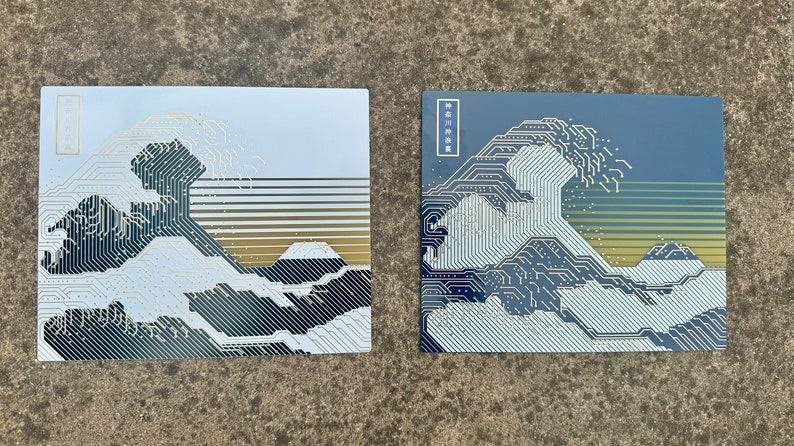 Both Variants of the Circuit Board Art with Sunlight reflecting off the gold traces