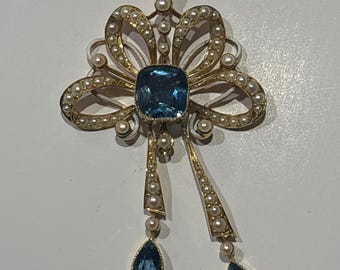 15ct yellow gold pendant with 3 x Victorian blue paste/topaz stones and 64 x seed pearls with 9ct gold chain.