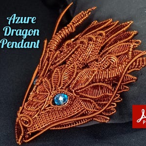 May include: A copper wire dragon pendant with a blue gemstone eye. The pendant is a wire wrapped design and is a DIY project. The image includes the text "Azure Dragon Pendant TUTORIAL".