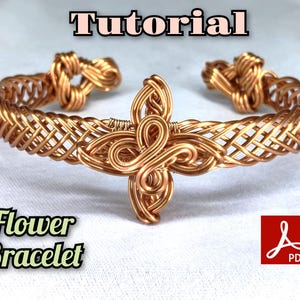 May include: A copper wire cuff bracelet featuring a woven lattice pattern and a central decorative floral-shaped wire element. The text "Tutorial" appears at the top, and "Flower Bracelet" is at the bottom, accompanied by a red PDF icon.