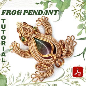May include: A gold-coloured wire frog pendant with a central stone in shades of green and purple. The image includes the text "FROG PENDANT" and "TUTORIAL".