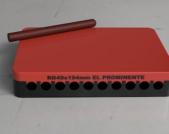 May include: A red and black cigar box with a cigar resting on top. The box has the text "RG49x194mm EL PROMINENTE" printed on the front. The cigar is a dark brown color.