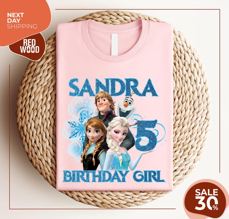 a pink shirt with a picture of two frozen princesses on it