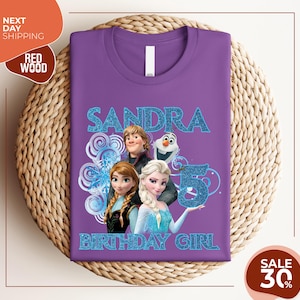 a purple tshirt with a picture of two frozen princesses on it