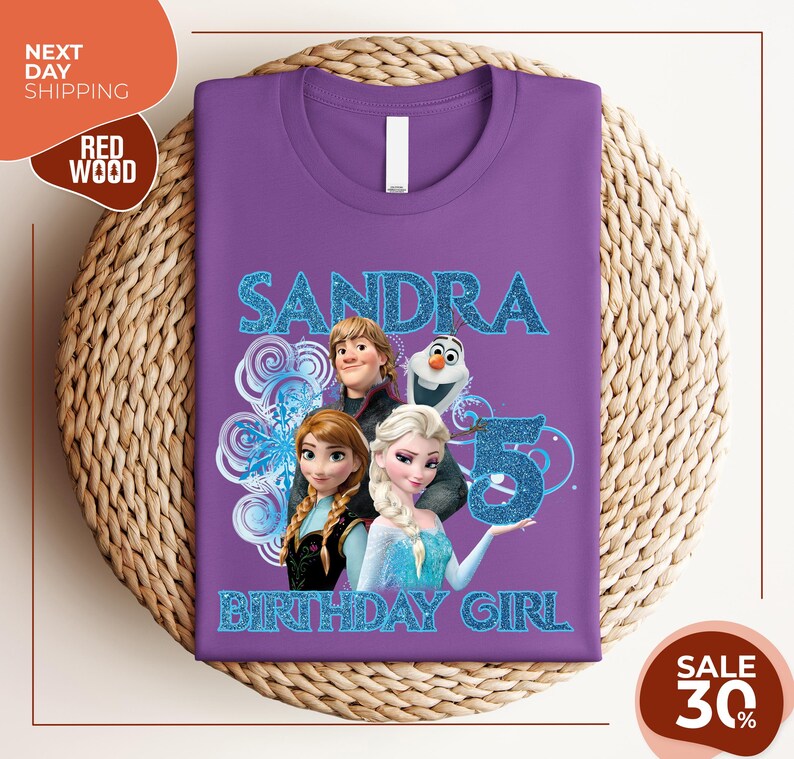 a purple tshirt with a picture of two frozen princesses on it