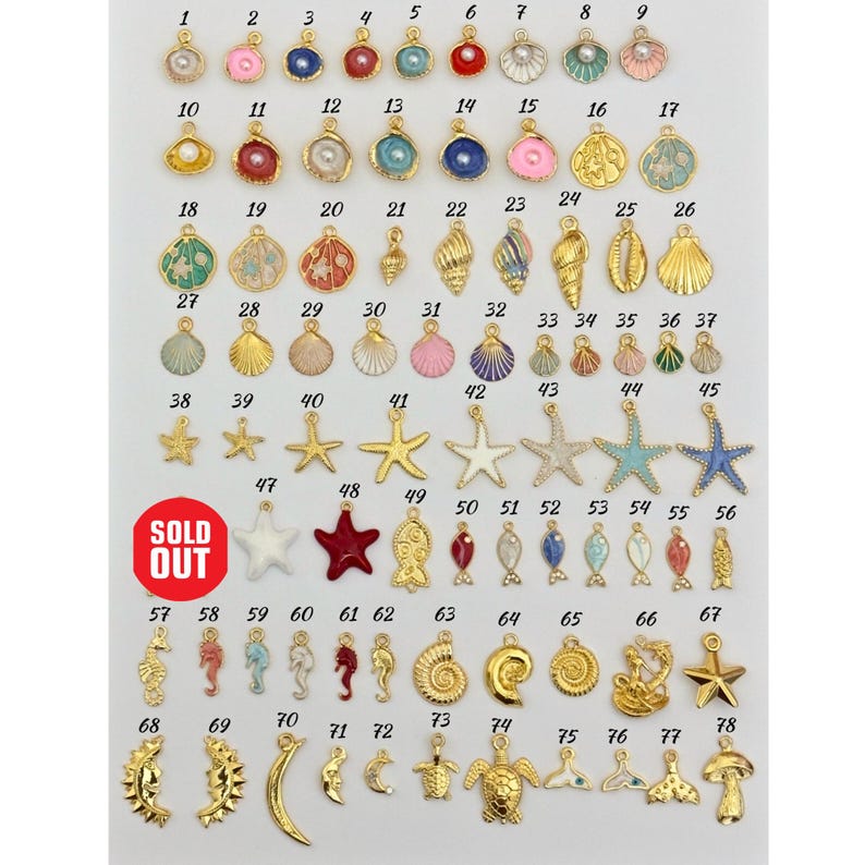 May include: A set of 78 gold-tone metal charms with various sea-themed designs, including seashells, starfish, fish, seahorses, and a turtle. The charms are arranged in rows on a white background, numbered 1 through 78.