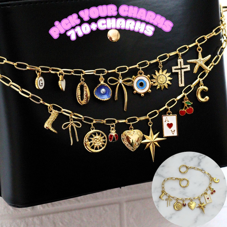 May include: A gold chain necklace with multiple charms, including a heart, a star, a sun, a horseshoe, a cherry, an eye, a seashell, a bow, a letter C, a letter G, a boot, a playing card, and a cross. The text "Pick Your Charms 710+ Charms" is written in pink letters on a black background.