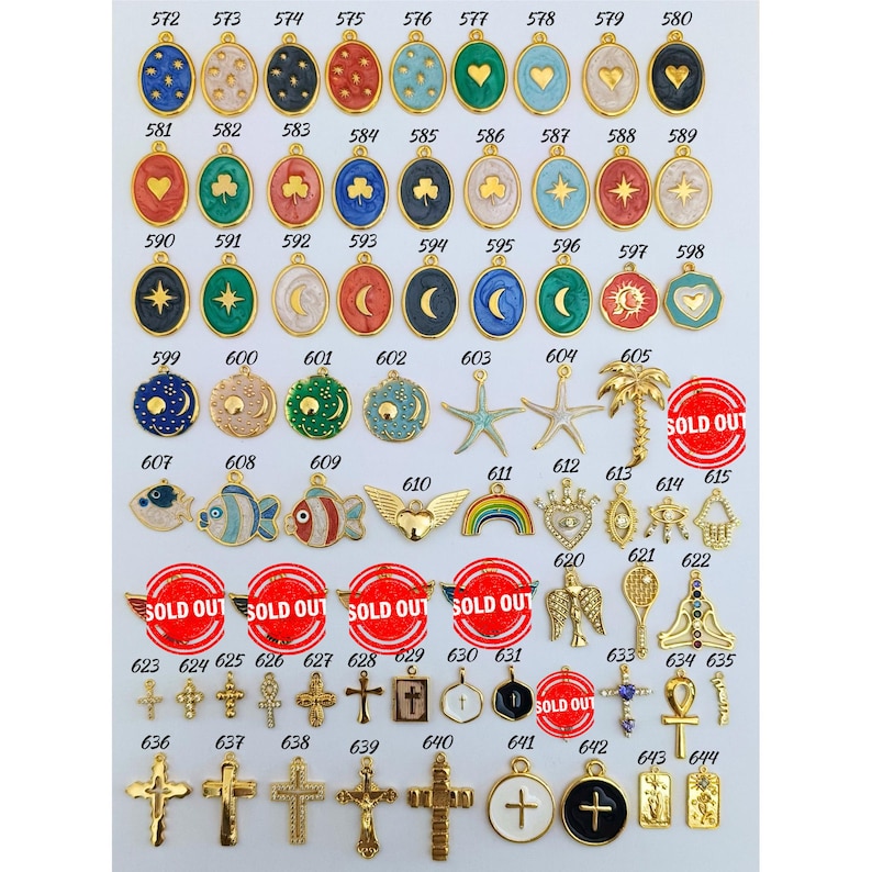 May include: Assortment of gold-tone charms with various enamel designs, including stars, hearts, moons, fish, and crosses. Some charms are marked as "Sold Out".