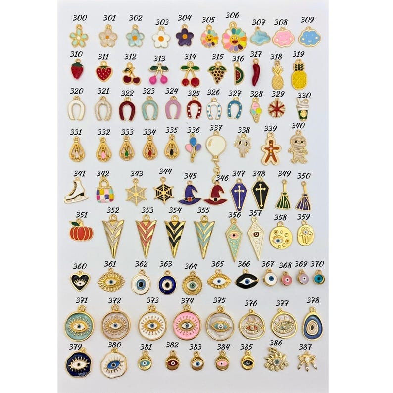 May include: Assortment of colorful enamel charms with gold metal accents. The charms feature various designs, including flowers, fruits, animals, and abstract shapes.