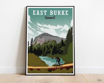 May include: A framed poster featuring a vintage travel design for East Burke, Vermont. The artwork depicts a cyclist on a wooden bridge, a mountain, trees, and a river. The poster has a teal and green color scheme.