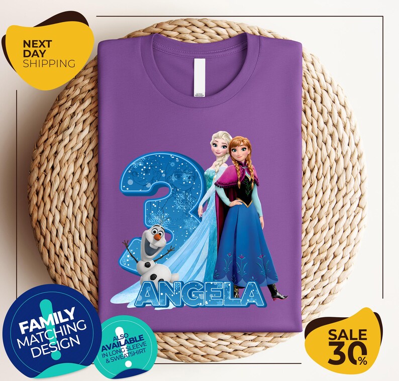 a purple shirt with a picture of two frozen princesses on it