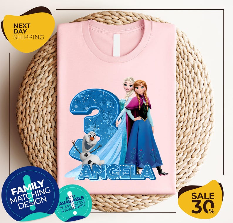 a pink shirt with a picture of two frozen princesses on it