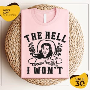 a pink t - shirt that says the hell i won't