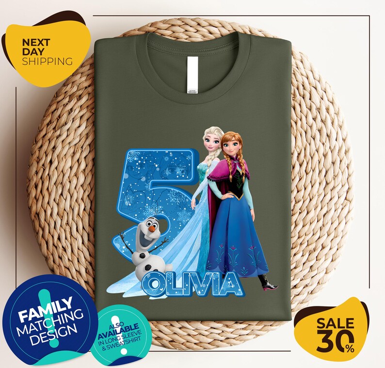 a green shirt with a picture of two frozen princesses on it