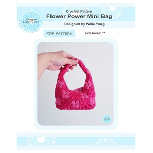 May include: A pink crocheted mini bag with a flower design. The bag has a single strap and is held in a hand. The text "Flower Power Mini Bag" is visible in the image.