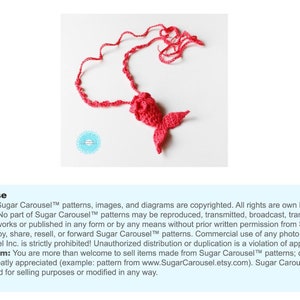 May include: A red crocheted mermaid tail necklace. The tail is curled into a heart shape. The text "Sugar Carousel&trade; patterns, images, and diagrams are copyrighted. All rights are own by Sugar Carousel Inc. No part of Sugar Carousel&trade; patterns may be reproduced, transmitted, broadcast, translated, used for derivative works or published in any form or by any means without prior written permission from Sugar Carousel Inc. Do not copy, share, resell, or forward Sugar Carousel&trade; patterns. Commercial use of any photo that belongs to Sugar Carousel Inc. is strictly prohibited! Unauthorized distribution or duplication is a violation of applicable laws. Finished Item: You are more than welcome to sell items made from Sugar Carousel&trade; patterns; credit to the designer is greatly appreciated (example: pattern from www.SugarCarousel.etsy.com). Sugar Carousel&trade; photos cannot be used for selling purposes or modified in any way." is displayed below the image.