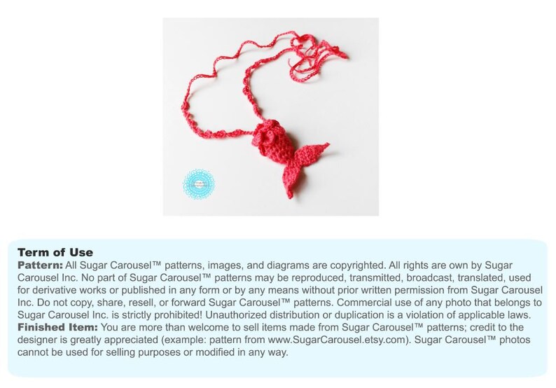 May include: A red crocheted mermaid tail necklace. The tail is curled into a heart shape. The text "Sugar Carousel&trade; patterns, images, and diagrams are copyrighted. All rights are own by Sugar Carousel Inc. No part of Sugar Carousel&trade; patterns may be reproduced, transmitted, broadcast, translated, used for derivative works or published in any form or by any means without prior written permission from Sugar Carousel Inc. Do not copy, share, resell, or forward Sugar Carousel&trade; patterns. Commercial use of any photo that belongs to Sugar Carousel Inc. is strictly prohibited! Unauthorized distribution or duplication is a violation of applicable laws. Finished Item: You are more than welcome to sell items made from Sugar Carousel&trade; patterns; credit to the designer is greatly appreciated (example: pattern from www.SugarCarousel.etsy.com). Sugar Carousel&trade; photos cannot be used for selling purposes or modified in any way." is displayed below the image.