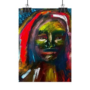 May include: A vertical rectangular wall art print featuring an abstract oil painting of a face. The portrait uses bold, expressive brushstrokes in vibrant shades of green, deep red, bright orange, and dark blue, suspended by two black metal clips.