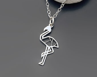 May include: A silver necklace with a geometric origami flamingo pendant. The pendant is made of thin metal and has a delicate, intricate design.
