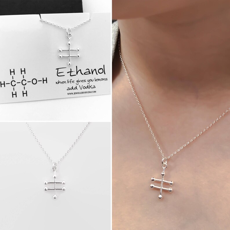 May include: A silver necklace with a pendant shaped like the chemical structure of ethanol. The pendant is on a silver chain. The necklace is displayed on a white card with the text "Ethanol" and the phrase "when life gives you lemons add Vodka".
