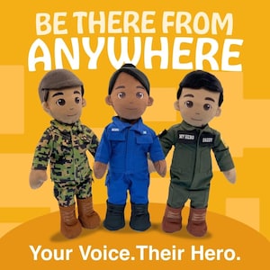 May include: Three plush dolls in military, astronaut, and pilot uniforms against a yellow backdrop. The dolls have brown skin and wear boots. Text at the top reads "BE THERE FROM ANYWHERE" and at the bottom "Your Voice. Their Hero."
