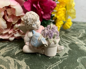 Vintage Angel Babies Cherub Angel sitting with flower pot and watering can - 1992 Angel Babies Cherub