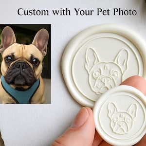 May include: A tan French Bulldog wearing a blue harness is pictured next to two white wax seals. The seals have an embossed French Bulldog face. The text "Custom with Your Pet Photo" is at the top of the image.
