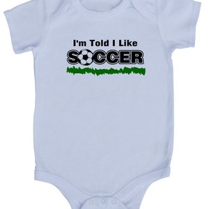 I'm Told I Like Soccer Silhouette Baby Bodysuit Boys & Girls Trendy Gift for Newborn and Birthday Gender Neutral, Sports, Outdoors image 1