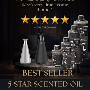 Peut inclure: Un diffuseur conique argenté et un noir à côté de plusieurs flacons transparents d'huile parfumée Aurora. Le texte indique : Feels like walking into a 5-star hotel every time I come home. Verified Customer. BEST SELLER 5 STAR SCENTED OIL.