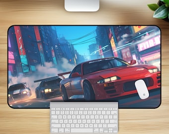 May include: A black and red gaming mouse pad with a cityscape background and three cars driving through the city. The cars are red, blue, and white. The mouse pad has a smooth surface and is designed for use with a computer mouse.