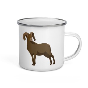 May include: White enamel camping mug with a brown mountain goat illustration.