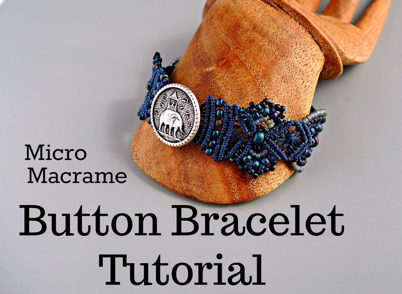 May include: A blue and black macrame bracelet with a silver button featuring an elephant design. The bracelet is on a wooden hand form. The text "Micro Macrame Button Bracelet Tutorial" is below the bracelet.