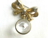 Vintage Bow and Dangle Lucite with Mustard Seed Brooch or Pin signed CORO