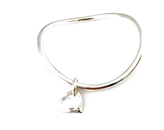 Sterling Silver Polished "XoX" Bangle Featuring Reversible Hammered Heart