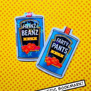 May include: Two rectangular magnetic bookmarks with a blue and white design, resembling Heinz Beanz and Farty Pants labels. Each features a cartoon illustration of beans and the text "MAGNETIC BOOKMARK!" on a yellow dotted background.