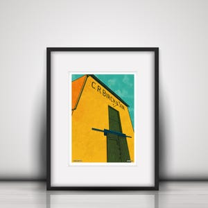Puede incluir: Una ilustración enmarcada de un edificio amarillo con una puerta verde y el texto "C.R. Birch & Son" sobre la puerta. El edificio está situado contra un cielo azul con nubes blancas.