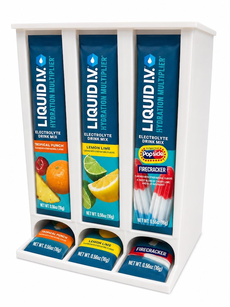 May include: A white dispenser filled with electrolyte drink mix packets. The packets are labeled "LIQUID I.V. Hydration Multiplier" and feature flavors like Tropical Punch, Lemon Lime, and Firecracker. Each packet is 0.56oz (16g).