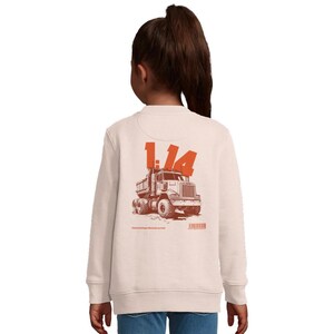May include: Cream-colored sweatshirt with a large orange graphic of a dump truck and the number "1.14" on the back. The graphic is a detailed illustration of the truck. The sweatshirt is long-sleeved and has a crew neck.