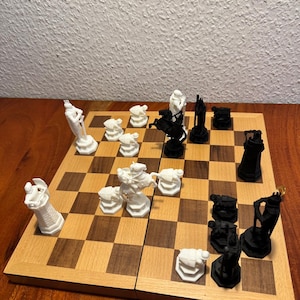 May include: A chess set featuring a wooden board with black and white pieces. The pieces are set up ready to play, with white pieces on one side and black on the other. The board has alternating light and dark brown squares.