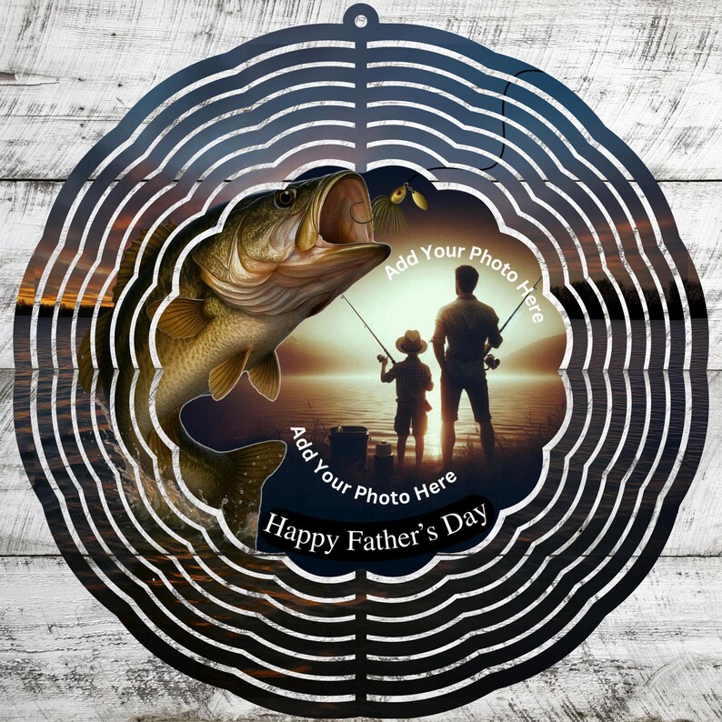 May include: A metal wind spinner with a fishing theme. The design features a large fish with an open mouth, a silhouette of a father and child fishing, and the text "Happy Father's Day". The design includes the text "Add Your Photo Here".