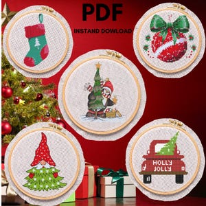 May include: Set of five Christmas cross-stitch patterns featuring a stocking, a snowman, a gnome, a truck with a tree, and a Christmas ornament.