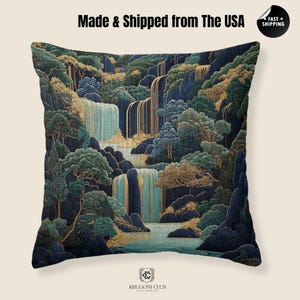 May include: Square decorative pillow with a scenic landscape design. The pillow features a waterfall scene with blue, green, and gold accents. The text "Made & Shipped from The USA" is printed on the top. The bottom of the pillow has the text "KRUGONI CLUB CHIC SUPPLIES".