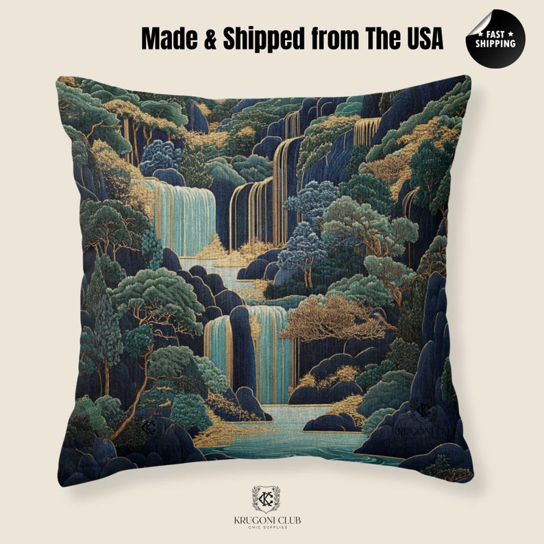 May include: Square decorative pillow with a scenic landscape design. The pillow features a waterfall scene with blue, green, and gold accents. The text "Made & Shipped from The USA" is printed on the top. The bottom of the pillow has the text "KRUGONI CLUB CHIC SUPPLIES".