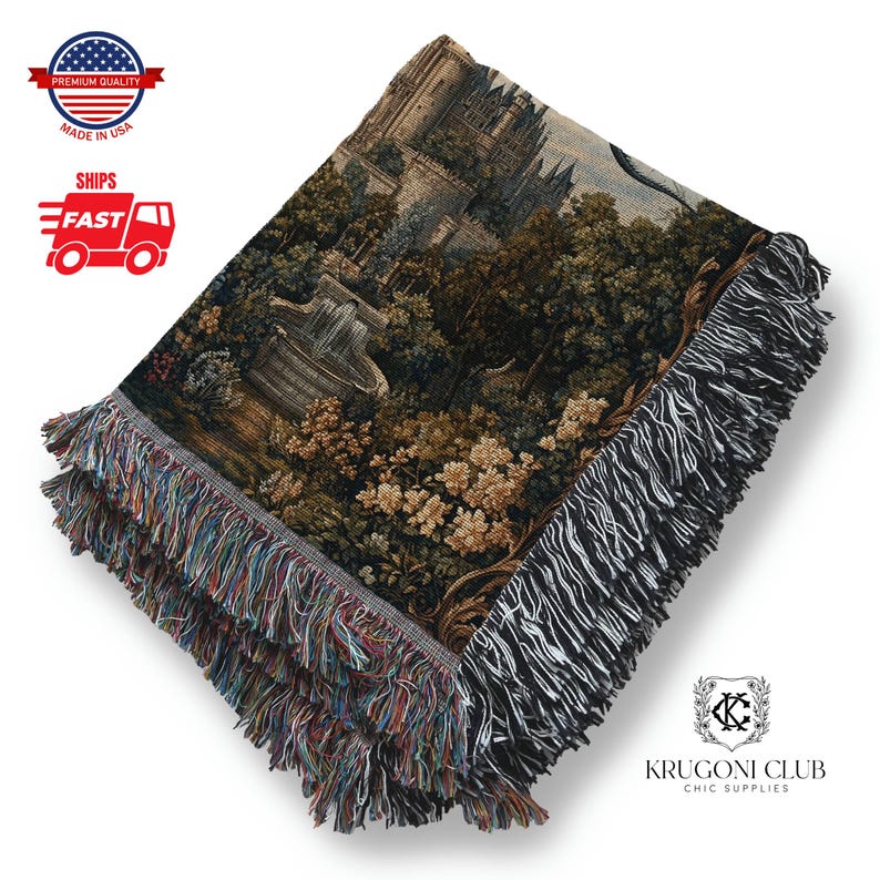 May include: Woven tapestry throw blanket with a detailed landscape scene featuring a fountain, trees, and a castle. The blanket has a fringed edge with multiple colors. The words "Premium Quality" and "Made in USA" are visible.