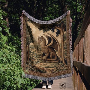 Medieval dragon woven tapestry wall hanging featuring a golden dragon in a lush gothic forest, perfect for castlecore home decor and dark academia fantasy enthusiasts.