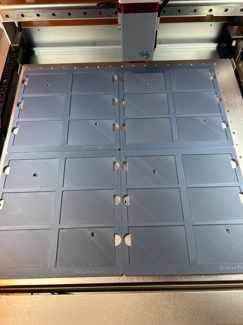 May include: A close-up of a blue plastic sheet with multiple rectangular cutouts. The sheet is labeled "Bottom Right" in the bottom right corner.