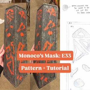 May include: Two gray and orange masks with a wood grain texture and orange accents. The text "Monoco's Mask: E33 Pattern + Tutorial" is displayed on the image. A drawing of a mask pattern is also visible.