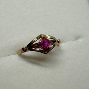 May include: A set of three ceramic mugs with a speckled, matte finish. The mugs are in cream, light grey, and dark grey. Each mug has a simple, minimalist design and a rounded handle. Ideal for tea or coffee.